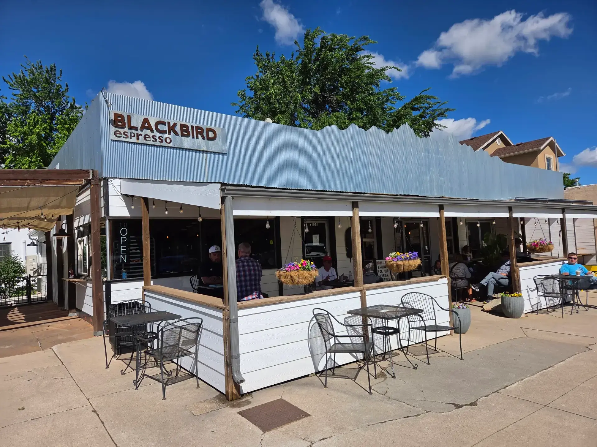The Blackbird Espresso storefront and patio on Main Street in Spearfish